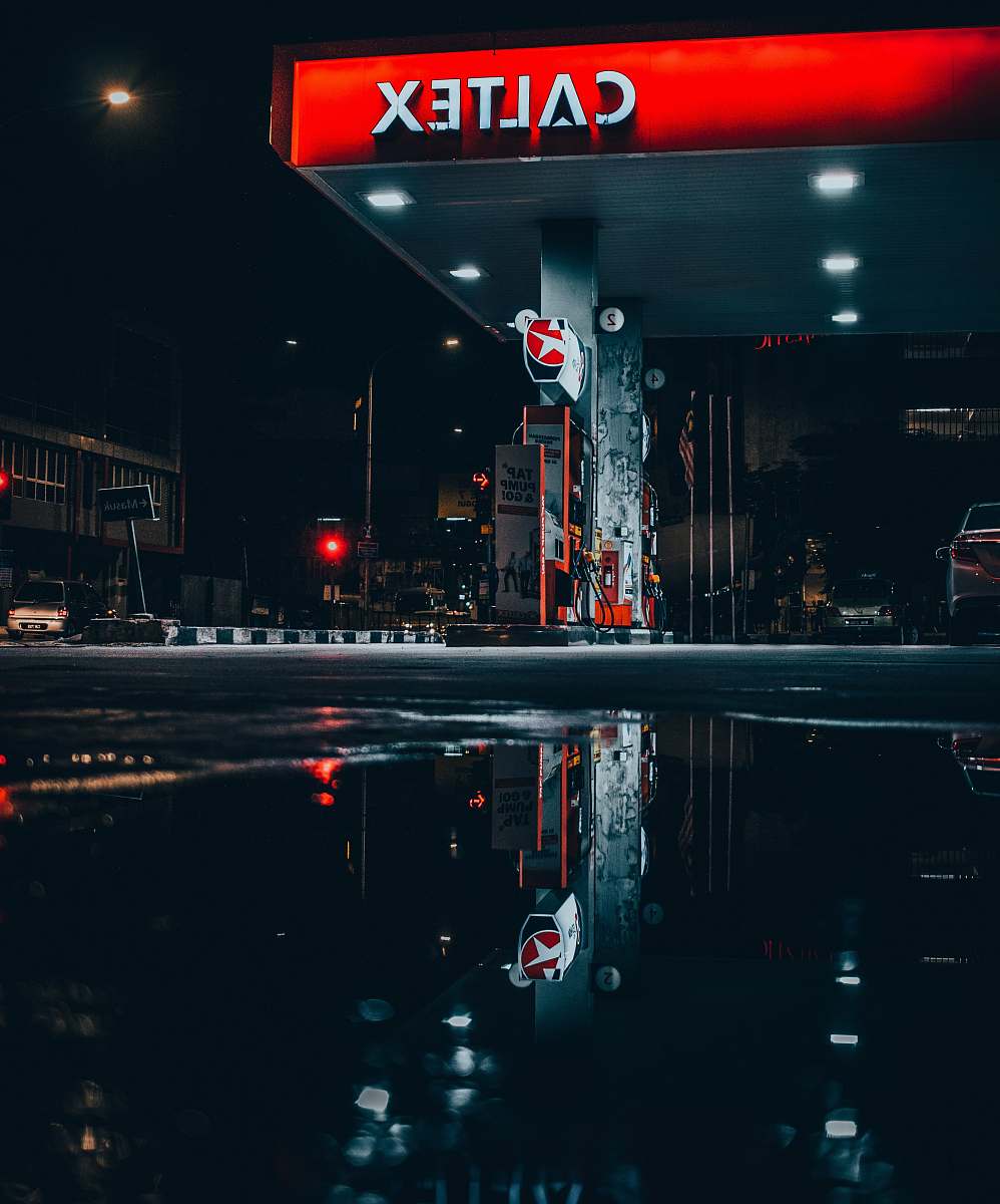 malaysia landscape photo of Caltex gasoline station puddle